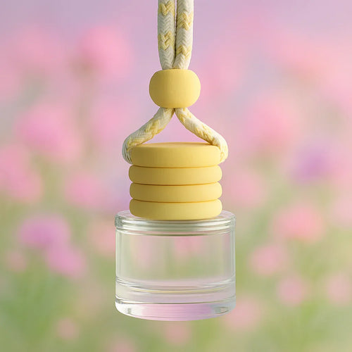 Clear glass jar with yellow rubber bands and a rope handle against a blurred floral background